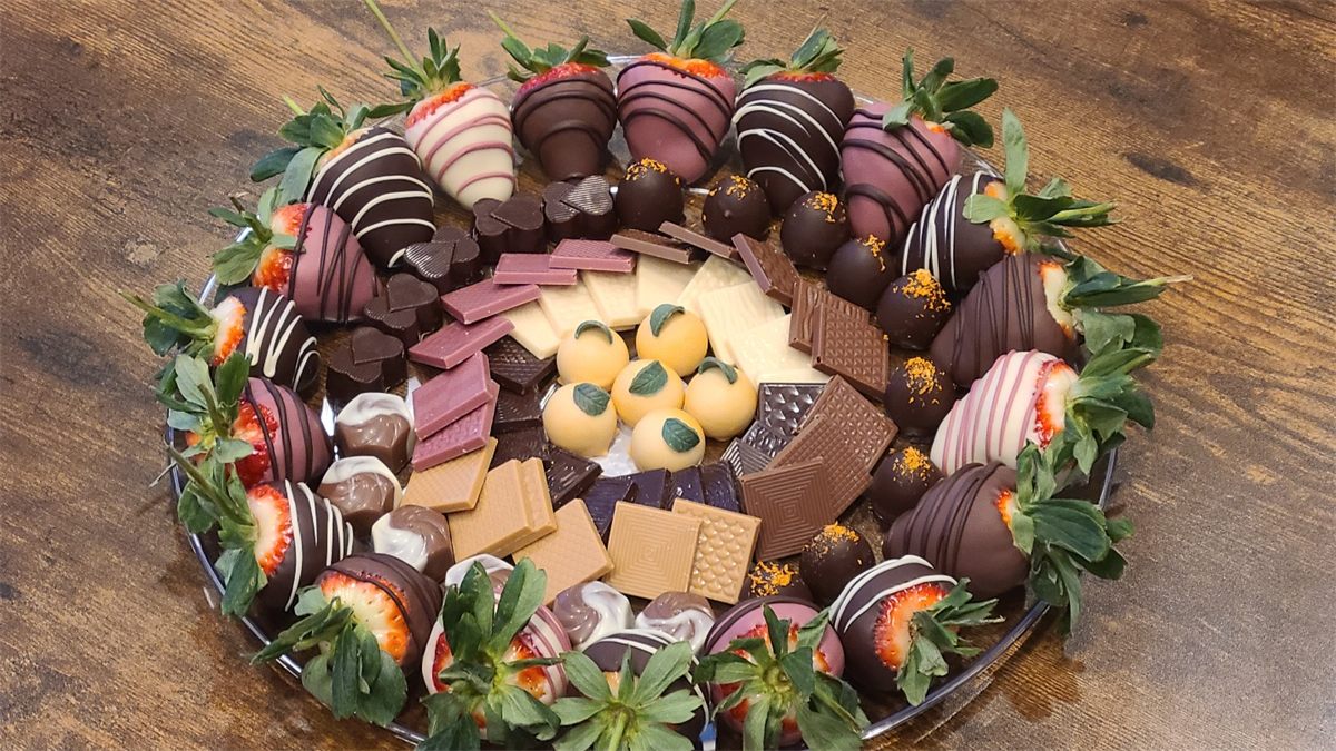 Showpiece platter of chocolate-covered strawberries and truffles