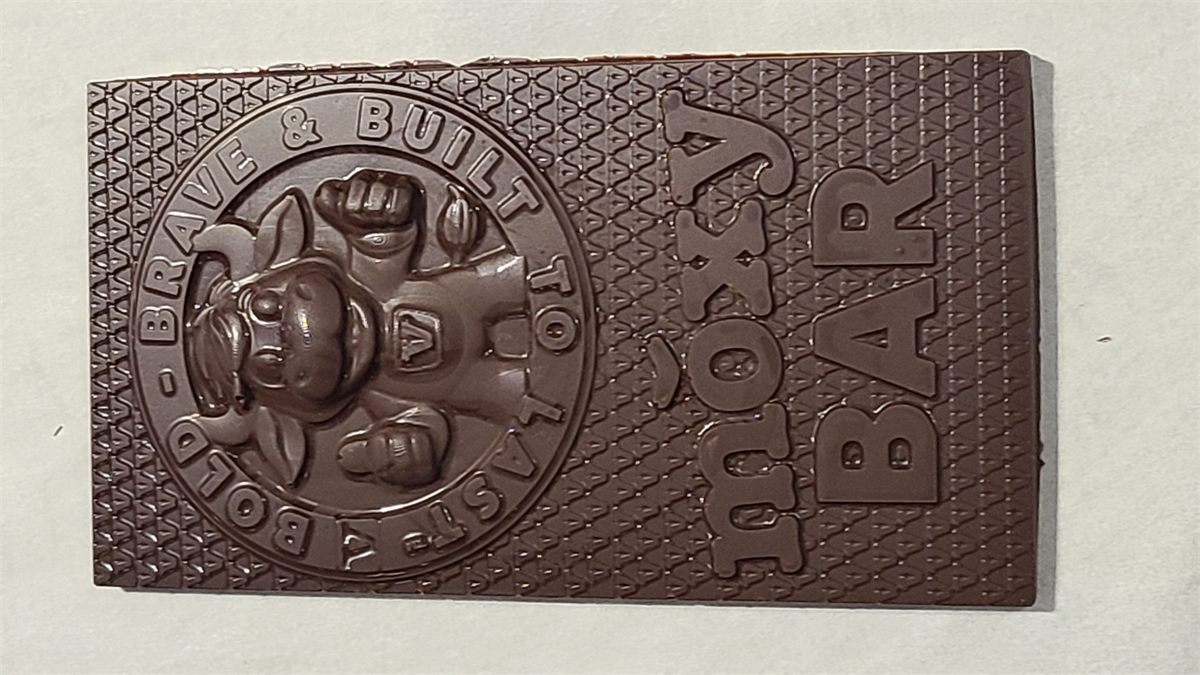 Custom-embossed Moxy chocolate bar with a bulldog mascot