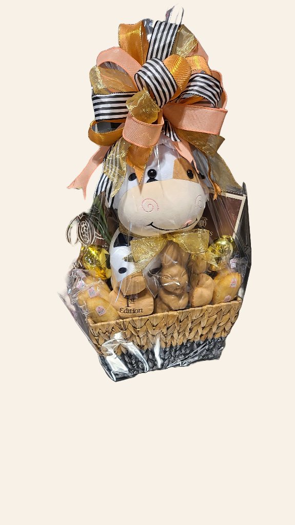 Themed chocolate gift basket wrapped and finished with ribbon